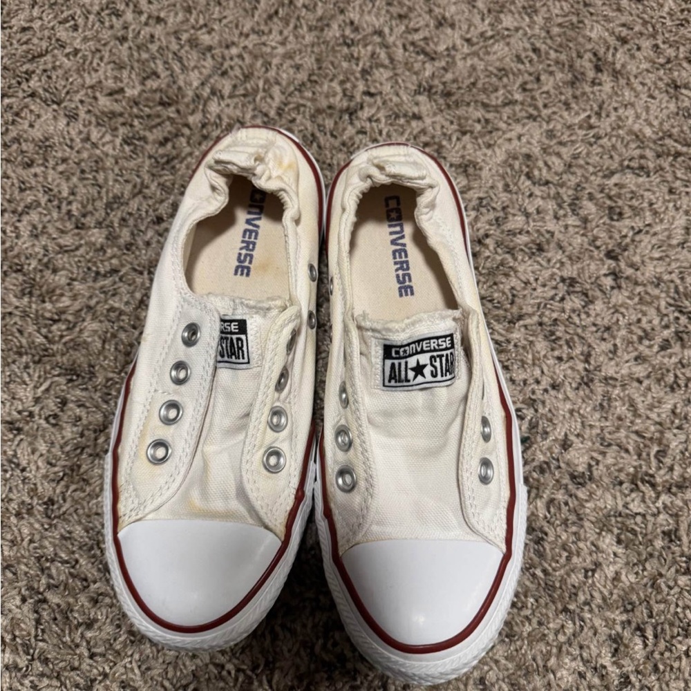 Converse Low Top Slip-On Sneakers in White with Red Trim